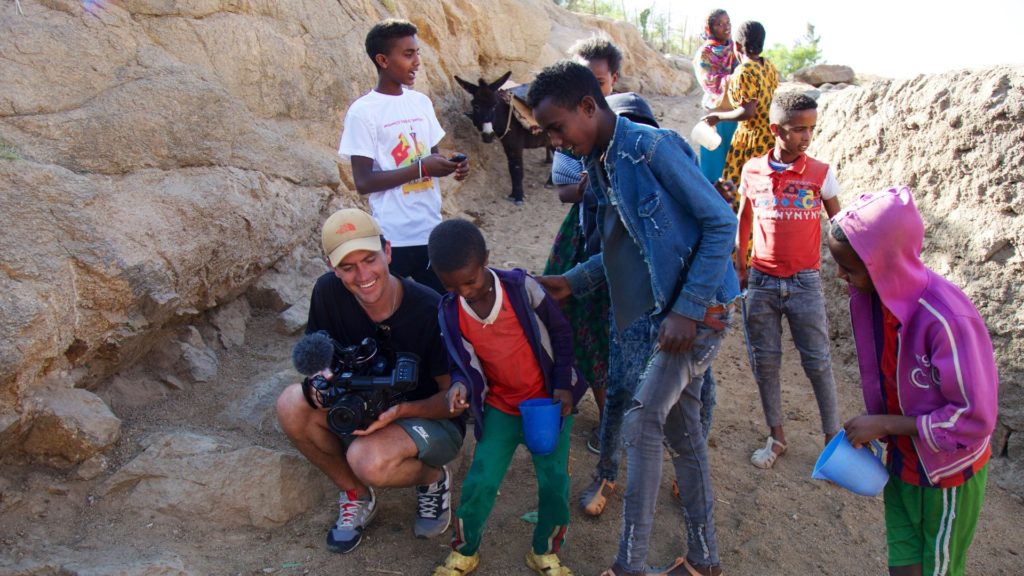 Filmmaker Will Lascelles with locals during the making of Towers Of Tigray