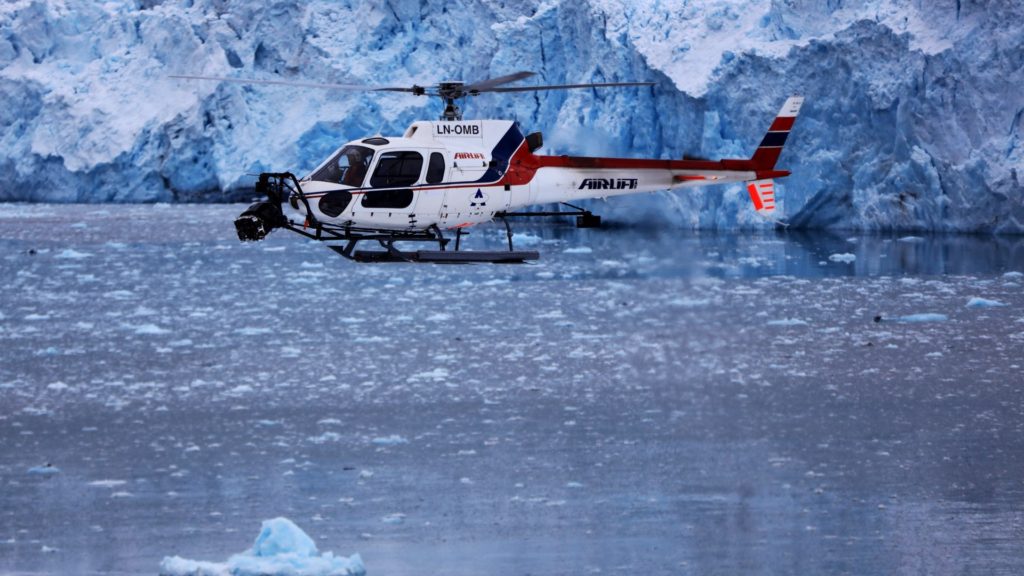 HFS Heli in front of Glacier, Svalbard. Picture - Aerial DP Jeremy Braben, Assoc. BSC, Helicopter Film Services